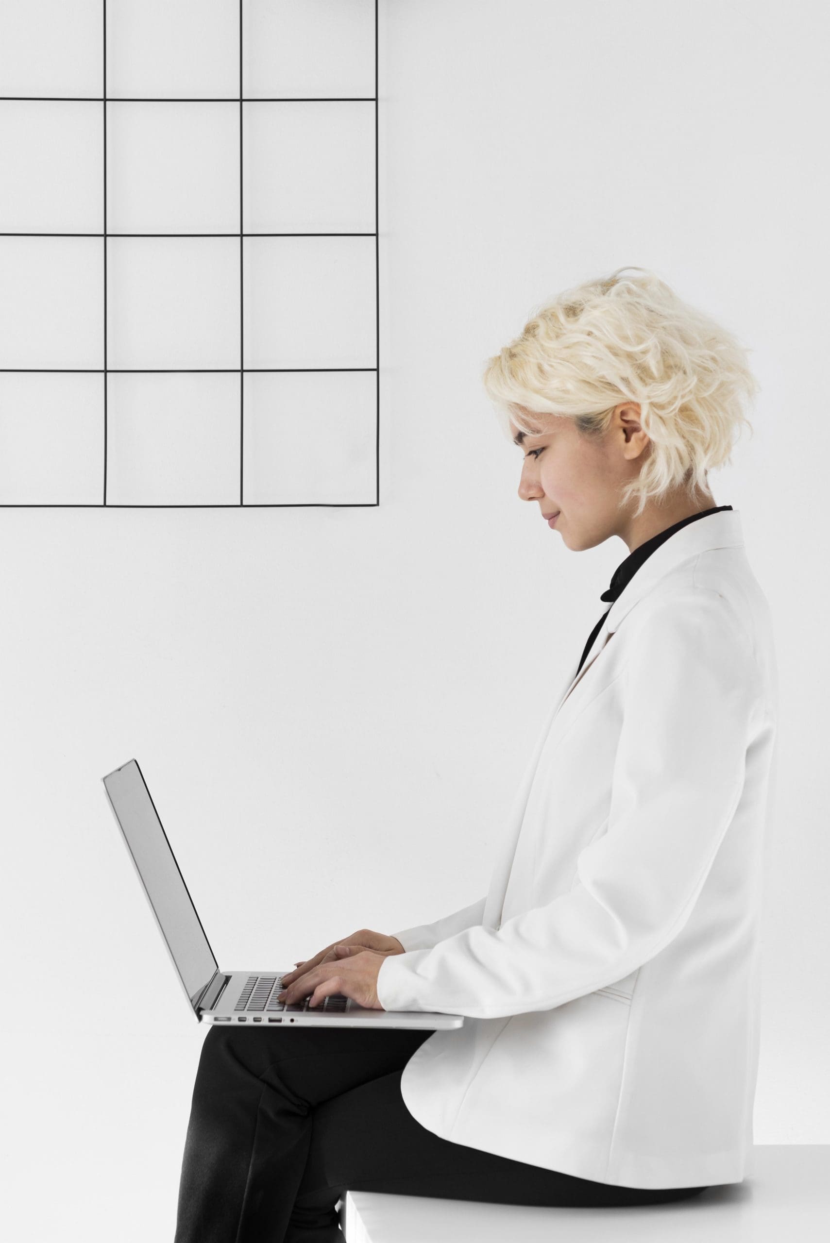 medium shot woman with laptop scaled