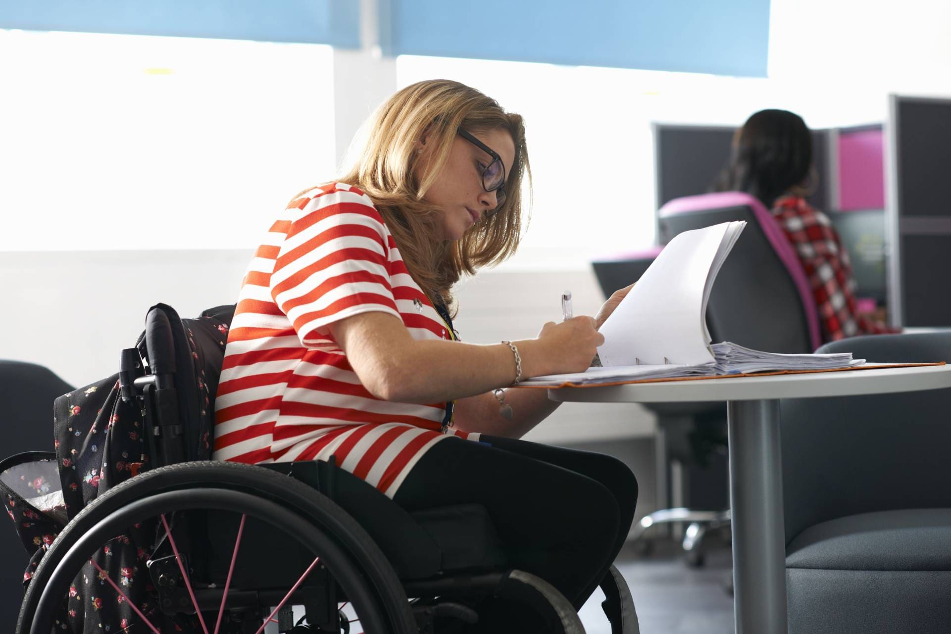 teenage girl in wheelchair writing up notes in cla 2025 04 04 16 53 54 utc
